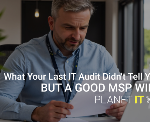 Business leader reviewing IT audit report on laptop while dashboard highlights hidden risks, inefficiencies, and gaps not covered by traditional IT audits